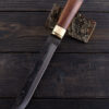 Messer mit Holzgriff und Lederscheide